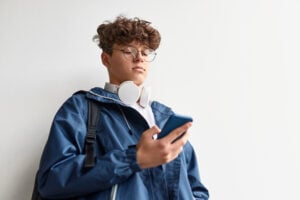 Teenager using smartphone